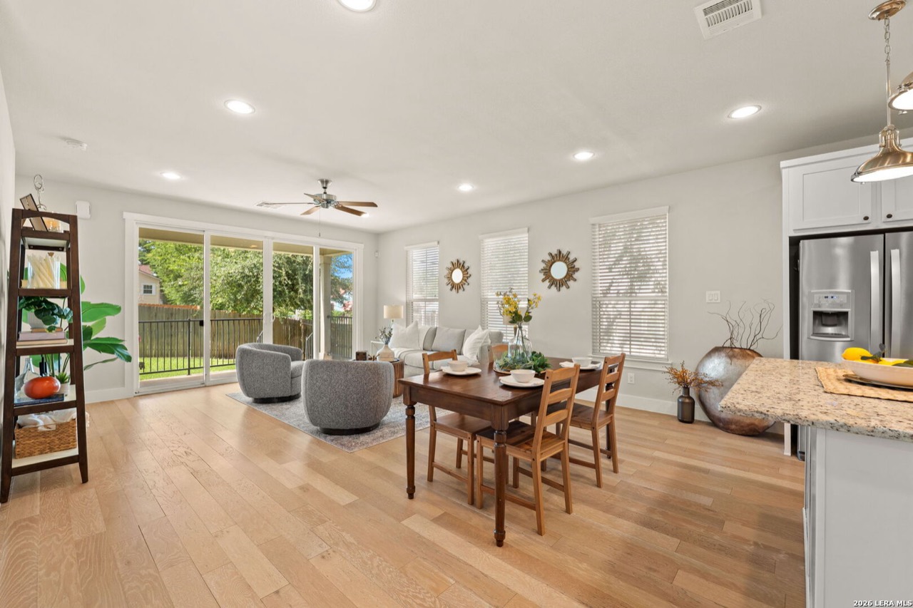 Staged living room and dining area at 202 Claremont Ave #102